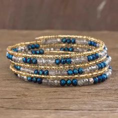 Beaded Wrap Bracelet in Blue and Gold - Sunlight and Sea | NOVICA Spacer Beads For Wire Bracelets, Cheap Blue Beaded Wrap Bracelet, Memory Wire Jewelry, Memory Wire Wrap Bracelets, Beaded Memory Wire Bracelets, Beadwork Bracelet, Boho Wrap Bracelet, Wire Bracelets, Memorial Bracelet