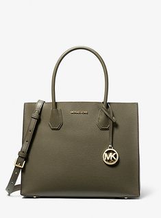 Crafted from pebbled leather, our iconic Mercer tote bag has been updated with accordion side gussets. The streamlined design features structured top handles and a removable crossbody strap for added versatility, while a median zippered compartment promises safekeeping for smaller items. Structured Top, Work Handbag, Michael Kors Mercer, Michael Kors Outlet, Elegant Bags, Streamlined Design, Bags Tote, Handbag Shoes, Leather Design