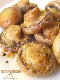 cooked mushrooms on a plate with garlic and pepper