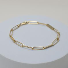 everyone's new favorite link, with an upgrade to 14k solid gold. introducing our much-loved Musha Link Bracelet - a new classic in a whole new light. the perfect addition to any outfit. its solid gold construction ensures a lifetime of wear and effortless style. fine 14k solid gold 2 grams 3.6mm thick lifetime warranty Timeless Bracelet With Rectangular Links As Gift, Classic Link Bracelets With Solid Link Construction, Everyday White Gold Bracelets With Rectangular Links, Classic Oval Link Tarnish Resistant Bracelets, Classic Oval Link Tarnish Resistant Bracelet, Classic Oval Link Tarnish-resistant Bracelets, Classic Link Bracelet With Jubilee Detail, Classic Oval Link Bracelet Jewelry, Classic Everyday Gold Bracelet, Tarnish Resistant