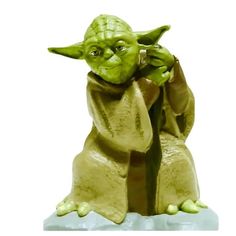 a star wars yoda figurine is shown on a white background