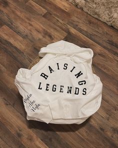 Raising Legend Hoodie with customizable sleeve; add your kids names or initials. CUSTOMIZABLE: Can say Raising girls or Raising Boys White Cotton Hoodie With Name Print, Personalized White Long Sleeve Hoodie, Personalized White Cotton Hoodie, Personalized White Casual Hoodie, Raising Legends, Raising Girls, Girls Hoodie, Raising Boys, Kids Names