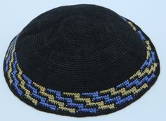 A stunning black knitted Kippah with a wide border in geometric ladder pattern of blue and brown. The color scheme of black and blue with brown is complementing each other and is enhancing its beauty. It is hand knitted from high-quality 100% cotton - threads of exceptional quality and appearance that make the Kippah durable, color fast and long-lasting. Wear this beautiful Kippah with pride and gain the respect from friends, family, and other members. Whether you are doing sports or sitting in Jewish Crochet, Dog Harness Pattern, Blue And Brown, Bar Mitzvah, Bat Mitzvah, Dog Harness, Black Knit, Cotton Thread, Color Scheme