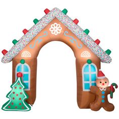 an inflatable gingerbread house with a christmas tree