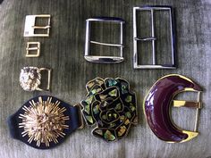 Here are a lot of 8 Belt Buckles for belt makers or seamstresses. Described beginning with the top left buckle and going clockwise. 1.Ralph Lauren polished gold-tone buckle marked RLL.  For a belt of 9/16" high. The buckle width- ¾" 2.Polished silver-tone buckle marked NY&Co. For a 2" high belt. The buckle width- 2" 3.Polished silver-tone buckle for a belt of 3/18" high. The buckle width-2 ¼". 4.Polished gold tone filled with maroon lacquer buckle for a belt of 2" high. The buckle width-3". 5.Mo Gold Dragon, Vintage Belt Buckles, Suede Belt, Designer Belt, Vintage Belt, Black Lacquer, Polish Silver, Vintage Belts, Suspender Belt