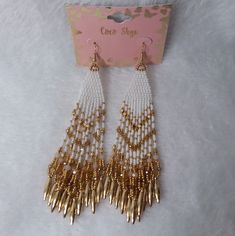 Multi-Dangle Pierce Earrings In Gold And White Beads By Coco Skye. The Back Of Card States Made In India, The Card May Be Made In China. New Without Tags. Did Not Removed From Card For Pictures. Measurements 5 Inches At Longest Point By 1 1/2 Inches At Widest Without The Dangle. Measurements Done Laying Down Are Estimated. # Ak- 5 Earrings In Gold, Beaded Dangles, White Beads, Seed Bead, Earrings Gold, Earings Piercings, Beaded Earrings, Seed Beads, Gold Earrings