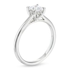 a white gold engagement ring with an oval cut diamond