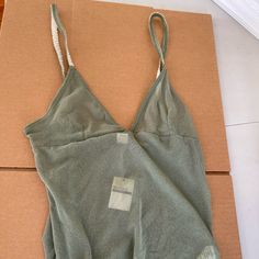 Authentic Hollister.Lace Tank. New With Tag. Size Large . Very Rare. I Purchased This In The Early To Mid 2000s, Y2k Era. It Has Never Been Worn. I Just Found A Lot Of My Old Vintage Hollister And Abercrombie Items From That Era In My Storage Unit, Check Out My Other Listings If You're Interested In Brand New With Tag Unworn Vintage Hollister And Abercrombie From The 2000s. They Were Purchased From 2001-2007 Mostly. New With Tag Spring Beachwear Seamless Tops, Spring Seamless Beachwear Tops, Casual Triangle Top For Loungewear, V-neck Top With Built-in Bra For Beach Season, Beachwear Tops With Spaghetti Straps And Built-in Bra, Beachwear Camisole Tops For Spring, Beachwear Camisole Tops With Built-in Bra, Spring Beachwear Camisole Tops, Fitted Triangle Top For Loungewear