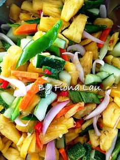 a bowl filled with assorted veggies on top of a table