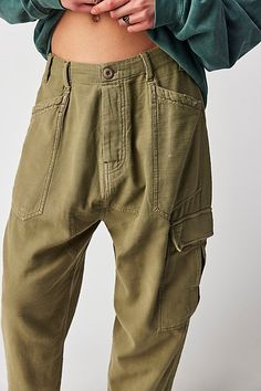 Just as comfy as they are effortless to style, these slouchy pants are featured in a low-rise, cargo-inspired silhouette with utility pockets throughout for added dimension. * Button fly closure * Oversized pouch pockets * Harem-inspired dropped crotch | Bay To Breakers Pants by Free People in Green, Size: S 2023 Wardrobe, Slouchy Pants, Utility Pockets, Wardrobe Edit, Small Waist, Boho Outfits, Pocket Pouch, Low Rise, Free People