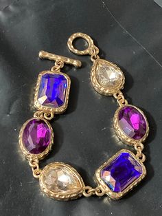 vintage 1970s Gold tone chain link charm bracelet with chunky diamanté purple clear Oval cabochons 20cm Vintage Purple Metal Bracelets, Purple Gemstone Metal Jewelry, Purple Oval Jewelry For Party, Purple Oval Party Jewelry, Jeweled Metal Crystal Bracelet Costume Jewelry, Metal Crystal Bracelet Costume Jewelry, Lovely Earrings, Drop Pendant, Vintage 1970s