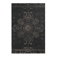 a black and white rug with an intricate design