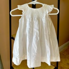 Light And Airy Soft Cotton Dress-White 6-12 Mths Classic Summer Smocked Dress, Classic White Smocked Dress, Cotton Smocked Dress With Ruffles For Baptism, Classic White Smocked Dress For Spring, White Cotton Smocked Dress For Baptism, Cute Cotton Smocked Baptism Dress, Cotton Smocked Dress For Baptism, White Short Sleeve Smocked Dress For Playtime, White Smocked Dress For Playtime