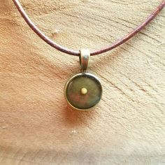 Rustic Mustard seed necklace in bronze and resin. This mustard seed necklace is a reminder that with "Faith as a Mustard seed", nothing is impossible (Matthew 17:20). The tiny seed that, when planted, can grow into a tree represents the huge effect that the tiniest bit of faith can have in our world. This  necklace is a reminder of the power of that faith. It is a wonderful keepsake. I still have the one my mother gave me! Also wonderful to send to a friend who needs encouragement, or to celebra Brown Waxed Finish Jewelry As Gift, Brown Jewelry With Waxed Finish As Gift, Adjustable Electroformed Bronze Necklace, Spiritual Gold Jewelry With Waxed Cord, Gold Waxed Cord Jewelry For Gifts, Vintage Waxed Cord Jewelry For Gifts, Antique Gold Soldered Round Pendant Jewelry, Brown Brass Spiritual Necklace, Antique Gold Jewelry With Soldered Round Pendant