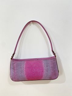 All Reserve items are final sale. Lilac leather embossed baguette. Magnetic closure. Comes with For the Ages dustbag. Condition: EXCELLENT/VERY GOOD Dimensions: Width: 10.6" Height: 4.7" Depth: 2" *** Our scale is based on the following: Excellent Items look visually unused. Very Good Items show minor signs of wear. Good Items show moderate signs of wear. Shoes may show wear such as moderate scuffing at the soles, insoles and heels. Handbags and accessories may show wear such as worn corners, mo Designer Leather Handheld Baguette Bag, Designer Handheld Leather Baguette Bag, Luxury Baguette Bag For Shopping, Designer Pink Satchel Baguette Bag, Designer Pink Shoulder Bag With Leather Lining, Designer Pink Baguette Bag With Detachable Handle, Designer Pink Bag With Leather Lining, Designer Pink Baguette Shoulder Bag, Designer Pink Baguette Bag For Shopping