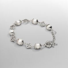 If it's not the real deal, it's not CRAFTD. Hand-strung with the finest freshwater pearls, this bracelet showcases each pearl encased in intricate filigree silver caps. Signature silver clovers, each adorned with 32 individually set AAA grade cubic zirconia stones, perfectly balance the design—offering the highest qual Luxury Silver Pearl Bracelet With Oyster Detail, Elegant Beaded Metal Bracelets With Pearl Charm, Sterling Silver White Gold Bracelets With Pearl Chain, White Gold Sterling Silver Bracelets With Pearl Chain, White Gold Sterling Silver Bracelet With Pearl Chain, Luxury Silver Pearl Bracelet With Pearl Drop, Luxury Silver Bracelets With Pearl Drop, Classic Silver Pearl Chain Bracelet, Elegant Silver Beads Bracelet