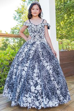 Your sweet girl will look timeless in this floral print long off the shoulder dress with A-line skirt by Cinderella Couture 8070. This beautiful ballgown features a cold shoulder sweetheart bodice embellished with floral embroidery, open lace-up back with a zipper closure, and a floor length A-line skirt with a sweep train. Matching women's dress sold separately: Style 8070J. Girls Floral Print Off Shoulder Gown by Cinderella Couture 8070 Designer: Bliss by Cinderella Couture Fabric: Glitter Tulle, Floral Embroidery, Beaded Embellishments, Polyester Please note: There may be a loss of glitter while wearing this dress due to the nature of the fabric Colors: Blue, Black Sizes: 2, 4, 6, 8, 10, 12, 14, 16 Occasions: Pageant, Flower Girl, Junior Bridesmaid, Formal Event, Wedding Guest, Holiday, Quince Dress, Off Shoulder Gown, Girls Formal Dresses, Off Shoulder Fashion, Tulle Gown, Off The Shoulder Dress, Junior Bridesmaid, Dress Purchase, Quinceanera Dresses