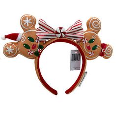 a christmas mouse ears headband with candy canes on it