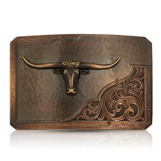 Rough Out with Team Roper Belt Buckle -Made in the USA! Please allow 10-14 days to ship Inspired by the traditional look of a Rough Out saddle, this vintage bronze finished rectangular buckle has an overall rectangular shape with just the tips of the corners cut. A lightly hammered surface, like rippled suede, contrasts next to the deeply engraved classic leather style along the bottom corner. An edge of lightly engraved scroll work frames the overall design with a line that runs along the borde Western Candle Holders, Western Picture Frames, Smith And Western, Checkbook Covers, Traditional Look, Western Purses, Horseshoe Art, Western Belt Buckles, Western Earrings