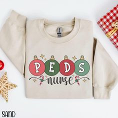 Peds Nurse Sweatshirt, Peds Christmas Shirt, Pediatric Nurse Sweater, Christmas Hospital Party Shirt, Christmas Pediatric Crew Nursing Group If you are looking for soft, well designed, and comfy t -shirts and Sweatshirts, you have come to the right place! We hand design all of the shirts in this shop and strive to provide beautiful shirts/Sweatshirts for all occasions. If you have any questions about our items, please feel free to shoot us a message anytime. We try our best to message everyone b Peds Nurse, Nurse Sweater, Western Sweatshirts, Pediatric Nurse, Hand Design, Nurse Christmas, Nurse Sweatshirt, Pediatric Nursing, Hoodie Girl