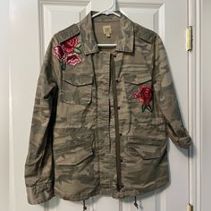 True Craft Camo Jacket With Embroidered Roses. Snaps And Zips Up And Has Draw String At Waist For A More Fitted Look. Never Worn. Has A Nice Feel To It And Very Stylish! Comes From A Smoke Free, Pet Friendly Home Spring Outerwear With Floral Applique And Long Sleeve, Spring Long Sleeve Outerwear With Floral Applique, Spring Floral Applique Long Sleeve Outerwear, Fall Outerwear With Floral Applique And Long Sleeves, Fall Long Sleeve Outerwear With Floral Applique, Fall Floral Applique Long Sleeve Outerwear, Casual Pink Outerwear With Floral Embroidery, Casual Fall Outerwear With Floral Applique, Pink Outerwear With Floral Embroidery For Fall