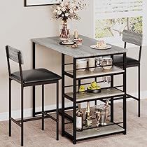 a small table with two chairs and a shelf on the floor in front of it