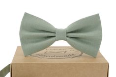 "Material - 100% Linen. Handmade. -------------------------------------------------- Fabric swatches color:11 ------------------------------------------------- Bow tie sizes: Large for Adult's Bow tie size Width: 4,7\" / 12 cm | Height: 2.5\" / 6.5 cm The bow tie is attached to an adjustable strap. Fitting approx 13'' - 19'' neck size. (For 14 yrs up to adult's)  Medium for Boy's Bow tie size Width:4\" / 10 cm | Height: 2.1\" / 5.5 cm The bow tie is attached to an adjustable strap. Fitting appro Light Green Bow Tie, Classic Green Bow Tie For Gifts, Green Bow Tie For Gifts, Green Bow Tie Ideal As Gift, Green Bow Tie Gift, Green Summer Ties For Gifts, Green Summer Ties For Gift, Green Summer Ties As Gifts, Green Summer Ties As Gift