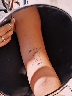 a woman's arm with writing on it that reads, my friend you are here