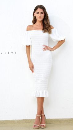 The Skyla Shirred Midi Dress in White by Velvi is a simple and elegant style that you'll feel your best in! Adding a hint of drama with the puff lantern sleeve detail and a shirred body style makes it the perfect wear-all-day style. White Midi dress Shirred body Pull-on style; no zipper required Trendy lantern sleeve Elasticised cuff on sleeve to keep their shape Elegant puff sleeves - can be worn on the shoulder or off the shoulder Can be worn on or off shoulder Ruffle detailing Slim fitting Go Spring Midi Dress With Balloon Sleeves And Ruched Detail, White Puff Sleeve Dress With Ruffles, White Off-shoulder Puff Sleeve Dress With Ruffles, White Puff Sleeve Dress With Gathered Billowy Sleeves, Fitted White Midi Dress With Lantern Sleeves, White Billowy Puff Sleeve Dress With Gathered Sleeves, White Fitted Midi Dress With Lantern Sleeves, Fitted Midi Dress With Lantern Sleeves For Brunch, Fitted Midi Dress With Elastic Shoulders For Brunch