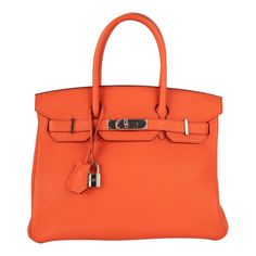 Hermes - (Made in France) 30 cm poppy orange togo calf leather Birkin bag with palladium-plated silvery metal ties and fastener, with a double handle, keys under a tiny cloche, and a padlock. 2016 collection piece sold with a certificated of conformity. Additional information: Condition: Very good condition Dimensions: Length: 30 cm - Height: 20 cm - Depth: 15 cm - Handle length: 34 cm Period: 21st Century Seller Reference: S258 Hermes Orange, Silk Bag, Animal Bag, Pink Monogram, Modernist Jewelry, Togo Leather, Kelly Bag, Satin Bags, Vintage Hermes