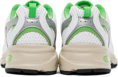 Low-top paneled mesh and faux-leather sneakers in white and green. · Perforated detailing throughout · Lace-up closure · Logo printed at padded tongue · Padded collar · Logo appliqué at sides · Pull-loop at heel tab · Logo printed at padded footbed · Mesh lining · Sculptural ABZORB® rubber midsole · Logo embossed at treaded rubber sole Supplier color: White/Green Green New Balance Running Shoes With Laces, Casual Green Sneakers With Ventilation, Green Low-top Running Shoes With Ventilation, Green Sneakers For Light Sports With Vented Sides, Green Synthetic Sneakers With Perforations, Sporty Green Sneakers With Ventilation, Green Low-top Running Shoes With Vented Sides, Green Lace-up Sneakers With Vented Sides, New Balance White Sneakers With Reflective Details