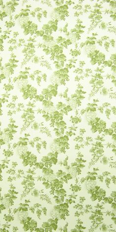 a green and white wallpaper with flowers on it