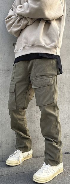 Mid-rise Cotton Parachute Pants With Pockets, Casual Green Jeans With Multiple Pockets, Green Baggy Cargo Jeans With Hip Pockets, Mid-rise Khaki Jeans For Streetwear, Khaki Mid-rise Jeans For Streetwear, Mid-rise Solid Color Utility Cargo Pants, Solid Straight Leg Bottoms With Cargo Pockets, Urban Green Jeans With Pockets, Casual Khaki Bottoms With Flap Pockets