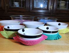 several bowls are lined up on a table