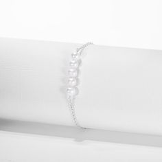 A delicate freshwater cultured pearl stranded bracelet, the perfect gift for a girl. Let her style up her favorite outfits with this beautiful and simple bracelet. Featuring white freshwater cultured pearls stranded together to create a band, and crafted from a 925 sterling silver, perfect for a girls sensitive skin. This dainty bracelet has an added on 1" extension to fit comfortably around her wrist. A complimentary gift box is included. Kids Bracelet, Kids Bracelets, Dainty Bracelet, Simple Bracelets, Dainty Bracelets, Bracelet Sterling Silver, Pearl Strands, Freshwater Cultured Pearls, Strand Bracelet