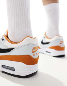 Nike Air Max 1 sneakers in white, gray and orange | ASOS Orange Low-top Sneakers For Light Sports, Orange Sneakers With Boost Midsole For Light Sports, White Urban High-top Sneakers With Air Max Cushioning, Sporty Orange Mid-top Sneakers, Orange Athleisure Sneakers With Air Max Cushioning, Urban Orange Custom Sneakers For Sports, Urban Style Orange Custom Sneakers For Sports, Orange Custom Sneakers With Air Cushioning, Nike White High-top Sneakers For Training