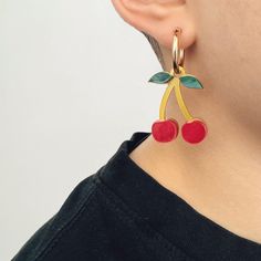 Introducing our Extra Juicy Cherry Earrings – a delightful fusion of summer vibes and stylish charm. These charm earrings are crafted from layers of marbled acrylic and metallic gold perspex, creating a super cute and vibrant accessory that adds a pop of summer to any outfit. The cherry fruit charms are available to purchase on their own or can be paired with 14k gold-filled or sterling silver hoops. Handcrafted in our London studio, the earrings will arrive in a logo box making them the perfect gift. Cherry Charm, Cherry Fruit, Cherry Earrings, Box Making, Sterling Silver Hoops, Silver Hoops, Guinea Bissau, Cute Earrings, Charm Earrings