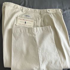 Brown Polo Ralph Lauren Pant. Classic Cream Tapered Leg Bottoms, Cream Cotton Pants With Welt Pockets, Classic Cotton Cream Pants, Classic Cream Cotton Pants, Classic Cream Bottoms With Welt Pockets, Cream Casual Cotton Chinos, Classic Beige Cotton Pants, Cream Cotton Chinos For Spring, Brown Polo