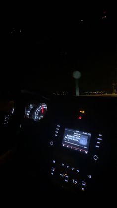 the dashboard of a car at night time