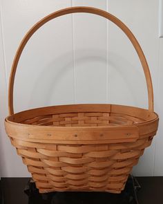 a wooden basket sitting on top of a table