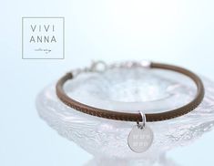 High quality nappa leather wrap bracelet with 2 personalized disc. This bracelet wraps once around the wrist + an adjustable extender chain of 5cm. -------------------------- CUSTOM Color of metal part: * silver * gold * rosé gold Color of nappa leather: * warm grey - Anthrazit * light grey- Hellgrau * light rose - Altrosa * creme - Creme * beige - Beige * cappuccino - Cappuccino * taupe - Taupe * khaki - Khaki * olive green - Olivgrün * black - Schwarz * dark brown - Dunkelbraun * white - Weiß Elegant Adjustable Engraved Leather Bracelet, Personalized Elegant Leather Bracelet As Gift, Elegant Engraved Silver Leather Bracelet, Personalized Elegant Leather Bracelet Gift, Elegant Personalized Leather Bracelet Gift, Elegant Personalized Leather Bracelet For Gift, Elegant Jewelry With Engraved Logo For Gift, Elegant Adjustable Leather Bracelet For Anniversary, Adjustable Silver Leather Bracelet With Engraving Option