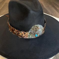 "Natural feather hat band. Brown feathers with black iridescent tips. Center crown measures 2.5\" W x 2.25\" H. Natural feathers Adjustable hatband *This product is for 1 single hat band. Hat not included." Feather Hat Band, Western Show Clothes, Cowboy Hat Bands, Beaded Hat Bands, Black Cowboy Hat, Boutique Inspiration, Happy Hat, Hat Bands, Black Iridescent