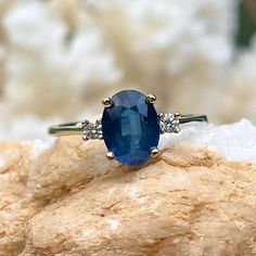 Estate/ vintage Polished 14KT white gold oval-cut, medium blue sapphire + round diamond accent ring. Stunning, vivid medium blue with shading hue color. Size 6 Can be resized for an additional fee Weight: 2.2g .08 CTW natural, round diamonds 2.00 CTW faceted sapphire Sapphire measures: 7mm x 5.1mm Genuine, oval-cut, medium blue sapphire (2) round, white, genuine diamonds; SI-1 clarity; G color Bright White Stones Stamped 14K and hallmark Excellent estate condition Oval Sapphire Ring In 14k Gold With Polished Finish, Oval Sapphire Jewelry With Polished Finish, Hallmarked Oval Sapphire Ring Fine Jewelry, Oval Sapphire Ring With Diamond Accents, Fine Jewelry, Oval Sapphire Gemstone With Multi-stone Detail, Saint Jewelry, Hue Color, White Stones, Blue Sapphire Diamond