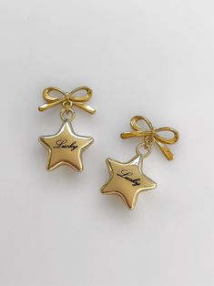 The sweetest accessory you've ever seen ౨ৎ Featuring a hand-engraved star pendant paired alongside a precious bow stud, these earrings will easily add a special touch to any look.  ☆ Made with 18K gold plated over brass. Lead and nickel free.  ☆ Post backing for maximum comfort and security. ☆ Handmade with love in Los Custom Charm Bracelet, Gold Bubbles, Sweet Accessories, Horseshoe Pendant, Character Board, Heart Chain, Gold Engraving, Classy Jewelry, Toggle Bracelet