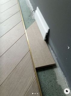 the corner of a room that has been taped off and is laying on the floor