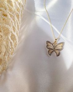 Give her the gift of wings with this beautiful butterfly necklace. DETAILS - 14k yellow gold butterfly with rhodium plating - Chain option is a 14k yellow gold cable chain - Chain style may vary slightly - Approximately 3/4 inch wide x 3/4 inch tall (including bail) VARIATIONS If you require any variation of this style (a different style chain, longer chain, etc.) feel free to message us. We will do our best to accommodate you. Additional costs may apply depending on the variation. POLICY We do Elegant 14k Gold Butterfly Jewelry, Fine Jewelry Butterfly-shaped Yellow Gold Jewelry, Fine Jewelry Yellow Gold Butterfly, 14k Gold Butterfly Jewelry For Formal Occasions, Formal 14k Gold Butterfly Jewelry, Fine Jewelry Butterfly Necklace For Anniversary, Fine Jewelry Butterfly Necklaces In White Gold, Butterfly Shaped Fine Jewelry Necklace For Anniversary, 14k Gold Butterfly Charm Pendant Necklace