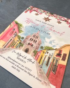 a wedding program is laying on the floor next to it's envelope, with an image of a church in the background