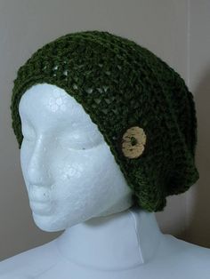 Handmade crochet slouchy hat in green colour. Made with aran yarn, It has a subtle ribbed detail throughout and is embellished with a handcrafted button made from coconut shell. Large size ,adult. Ribbed Crochet Hat, Green Crochet Hat, Ribbed Crochet, Crochet Slouchy Hat, Slouchy Beanie Hat, Green Crochet, Slouchy Hat, Slouchy Beanie, Coconut Shell