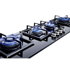 a black gas stove with blue burners on it