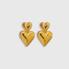 Elevate your style with the stunning Heart Statement Earrings from Biella Vintage. Crafted with exquisite attention to detail, these earrings feature a luxurious gold-plated finish that adds a touch of elegance to any outfit. The bold heart design makes a chic statement, perfect for both day and night wear. Whether you're dressing up for a special occasion or adding a glamorous touch to your everyday look, these earrings are the perfect accessory. Let your style shine with Biella Vintage. Material: High-quality 18k gold-plated Design: Bold heart shape Style: Statement, versatile Occasions: Perfect for any event or casual wear Enhance your jewelry collection with a piece that embodies timeless elegance and modern charm. Gold Earrings For Valentine's Day Formal, Gold Earrings For Valentine's Day Formal Occasion, Formal Gold Earrings For Valentine's Day, Gold Double Heart Earrings For Formal Occasions, Gold Heart-shaped Earrings For Formal Occasions, Gold Heart-shaped Formal Earrings, Gold Plated Earrings For Valentine's Day Formal, Gold Plated Earrings For Valentine's Day Formal Occasions, Gold Double Heart Earrings For Anniversary